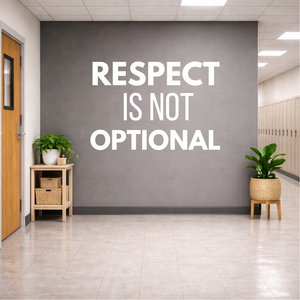 Motivational quote 'RESPECT IS NOT OPTIONAL' on a wall in an office setting.