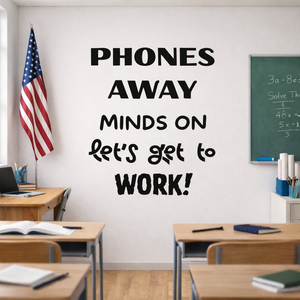 Classroom with 'Phones Away, Minds On, Let's Get to Work!' wall decal.