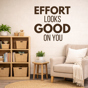 Classroom with a bookshelf, chair, and motivational wall quote 'Effort Looks Good On You'.