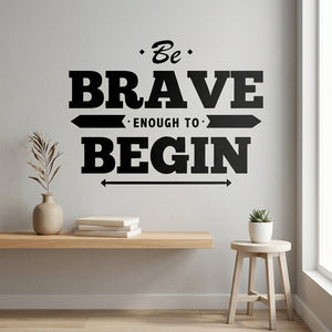 Be Brave Enough to Begin wall decal mockup centered in a bright classroom setting.