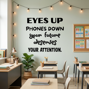 Classroom with motivational quote on the wall: 'EYES UP PHONES DOWN your future deserves YOUR ATTENTION.'