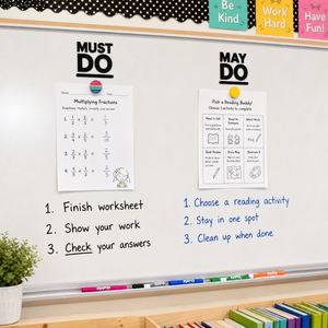 Must Do / May Do whiteboard decal set shown small at the top of a classroom whiteboard with worksheets and magnets underneath.