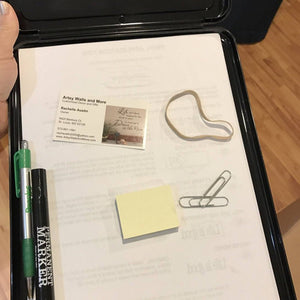Inside of the Black Storage Clipboard with convenient storage for pens and more 