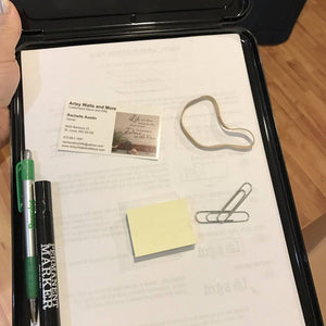 Inside of the Black Storage Clipboard with convenient storage for pens and more 