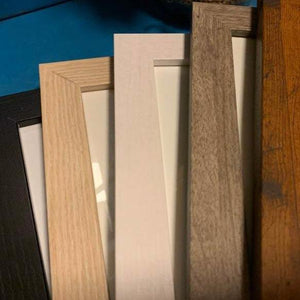 5 wooden frame choices: black, blonde, white, gray, and honey